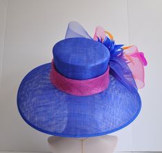 "Description: 100% Sinamay, light and comfortable *Wide brim measure Appr: 6.5\" brim *The crown is decorated with feather flowers, peacock feathers and crin ribbon bow *Head girth is 22\"-23.5\",adjustable string inside can give you the best fit. *Great for Kentucky Derby, Church, Wedding, Tea Party or other special event Many color decorations are AVA, just like: hot pink, light blue, royal blue, black, burgundy, yellow, white, dusty pink, taupe." Royal Blue Hat With Curved Brim For Kentucky Derby, Blue Fedora Sun Hat For Kentucky Derby, Blue Wide Brim Fascinator For Garden Party, Fitted Blue Hat With Feathers, Blue Fitted Wide Brim Straw Hat, Blue Mini Hat With Short Brim For Garden Party, Blue Feathered Hat For Races, Blue Short Brim Mini Hat For Garden Party, Brimmed Blue Top Hat For Royal Ascot