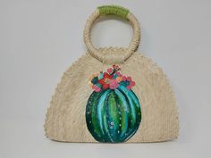 I love Mexico celebrates the native crafts of Mexico and the artists that produce them, enabling them and their communities to get recognized for their talented work and achieve economic stability for their families. This listing is for this bag shown on the picture, made of palm leaves and 100% natural materials. The tassels or other accessories on the picture are not included. The cactus paint is 100% made by hand. Measurements : please see pictures for exact size. All size units are in inches Bohemian Summer Straw Tote Bag, Artisan Bag For Summer Gift, Bohemian Straw Tote Beach Bag, Bohemian Beach Bag With Handles For Spring, Bohemian Spring Beach Bag With Handles, Green Handheld Beach Bag, Handheld Green Beach Bag, Bohemian Straw Tote Bag For Daily Use, Handwoven Handheld Beach Bag For Summer