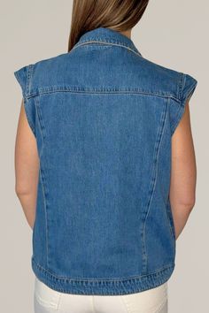 upgrade your casual rotation with this modern take on a denim vest, featuring charming ruffle shoulder details. this versatile piece offers a contemporary twist on a classic design, crafted from high-quality denim for a durable yet comfortable fit. perfect for layering over your favorite tops and dresses, this denim vest adds a touch of feminine flair and effortless cool to any outfit. 100% cotton hand wash cold | hang dry | cool iron | do not bleach do not dry clean model is wearing a size small for a more oversized look, size up Trendy Denim Vest For Layering, Trendy Denim Workwear Vest, Trendy Denim Work Vest, Sleeveless Denim Jacket For Summer Workwear, Trendy Sleeveless Denim Vest For Work, Sleeveless Denim Blue Top For Work, Casual Medium Wash Vest For Workwear, Denim Blue Sleeveless Workwear Vest, Trendy Sleeveless Denim Vest For Everyday