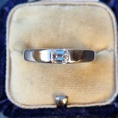 Beautiful & elegant solitaire 18ct white gold band, set with a 0.42ct emerald cut diamond in a flush half-bezel setting. The diamond is superb quality, very clear, bright and sparkly. The ring is in great condition, minimal signs of wear. Diamond: 0.42ct, clarity VS, colour G-H, emerald cut. Width: 3.7mm at the widest point. Hallmark: Maker's mark is rubbed, possibly reads as 'C&F', gold crown symbol, '750' for 18ct gold assay London, date letter 'a' for 2000, millennium 2000 mark Size: UK L1/2, Modern Emerald Ring With Rectangular Diamond, Modern Rectangular Emerald Ring With Diamonds, Modern Rectangular Emerald Diamond Ring, Rectangular Emerald Ring With Brilliant Cut Diamond, Classic Emerald Ring With Diamond In Rectangular Shape, Classic Rectangular Emerald Ring With Diamond, Classic Emerald Ring With Brilliant Cut For Formal Occasions, Classic Emerald Ring With Brilliant Cut For Formal Events, Platinum Solitaire Emerald Ring For Formal Occasions