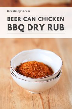 a white bowl filled with bbq dry rub on top of a wooden table