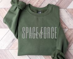 Space Force wife sweatshirt/crewneck! This will be perfect for engagement gift/Deployment Gifts/graduation gift, etc... Ideal for any situation, a unisex heavy blend crewneck sweatshirt is pure comfort. These garments are made from polyester and cotton. This combination helps designs come out looking fresh and beautiful. The collar is ribbed knit, so it retains its shape even after washing. There are no itchy side seams on these sweaters.  .: 50% cotton, 50% polyester .: Medium-heavy fabric (8.0 Wife Sweatshirt, Custom Crewneck Sweatshirts, Deployment Gifts, Space Force, Text Shirt, Special Gifts For Her, Matching Sweaters, Alabama Football, Sweatshirt Crewneck