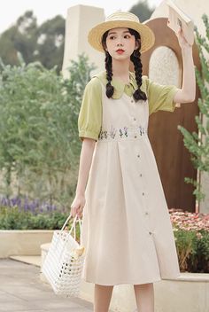 Button down dress with a v-neckline and wide sleeve holes for layering with your favorite blouses and sweaters. Embroidered wildflowers along the waistline with waist ties. Midi length. S: 36" chest and waist, 39" lengthM: 37.5" chest and waist, 39" lengthL: 39" chest and waist, 39.5" lengthXL: 40.5" chest and waist, 39.5" length Cotton Dresses With Button Closure For Spring, Casual Floral Embroidered Dress For Spring, Casual Floral Embroidery Dress For Spring, Casual Spring Dress With Floral Embroidery, Casual Buttoned Dresses For Garden Party, Spring Cotton Button-up Dresses, Casual Dress With Button Closure For Garden Party, Spring Dresses With Buttons For Garden Party, Beige Button Dress For Spring