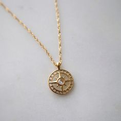 "Finding your path is a personal journey, a dance between self-discovery and the whispers of your heart, leading you to the destination only meant for you." Find your way in style with our Compass Necklace. This playful pendant necklace features a sparkling cubic zirconia center. The perfect accessory for any adventure, it adds a touch of whimsy to any outfit. -16" in length with 2" extender -stainless steel, gold plated Elegant Charm Necklace With Compass Design, Finding Your Path, The Whispers, Compass Necklace, Find Your Way, Personal Journey, Casual Style Outfits, Style Outfits, Self Discovery