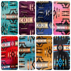 six different colored rugs with native designs on them, all in various sizes and colors