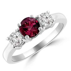 three stone ruby and diamond ring in white gold