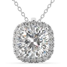 Stunning and shining, this moissanite halo pendant necklace in 18k white gold over silver would make a beautifully unique gift for any special occasion. Hanging in an 18-inch cable chain that is secured by a spring ring clasp, this handmade necklace features 1 carat cushion cut real moissanite and .25 carat high quality moissanites for a total weight of 1.25 carat. Crafted and designed by our passionate jewelry experts, this affordable pendant necklace is made with high quality and real gemstone Gold Diamond Pendant Necklace, Diamond Necklace Simple, Fine Gold Necklace, Cushion Cut Diamond Ring, Diamond Jewelry Set, Cushion Cut Diamond, Solitaire Pendant Necklace, Moissanite Necklace, Diamond Jewelry Necklace