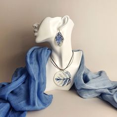 Introducing the "Misty Field Leaves" jewelry set - a charming duo featuring a porcelain pendant and matching earrings. This exquisite collection showcases the beauty of nature with its handcrafted design of delicate field flower leaves. Each piece is adorned with intricately pressed and delicately painted blue leaves, contrasting against the pristine white background. The combination of white and blue evokes a sense of tranquility and captures the essence of a misty field in bloom. Embrace the e Misty Field, Leaves Jewelry, Mountain Crystal, Blue Nature, Flower Leaves, Real Leaves, Ceramic Necklace, Leaf Jewelry, Gifts For My Wife