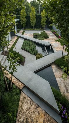 an outdoor garden with water and trees