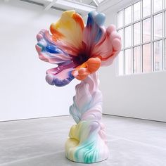 a colorful sculpture is in an empty room