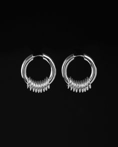 A gathering, high-glossed and gleaming. Odessa Earrings to passage your day to day. A classic hoop accented with a string of high-polished circular rings freely looped through for added movement. Fit for all styles and expressions. Customise these to your desired weight and look by tuning up or down the number of accent rings. Sold as a pair. Each piece is lovingly crafted by hand, under ethical working conditions. Please allow for minor imperfections that are true to handcrafted jewelry. No two Facial Jewelry, Accent Rings, Going Shopping, Alternative Jewelry, Dope Jewelry, Funky Jewelry, Jewelry Lookbook, Day To Day, Brass Gold