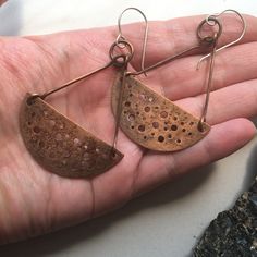 Made By Me In My Home Studio. Large Half Circles Of Textured Copper Swing Freely In These Trapeze Style Earring. Made From Recycled Roofing Copper That Is Pierced And Textured, Antiqued With Liver Of Sulfur And Sealed With Jewelers Wax. The Earrings Are Finished With Handmade Sterling Silver Ear Wires. Artisan Copper Earrings For Everyday, Artisan Copper Earrings For Everyday Wear, Handmade Rust-colored Earthy Earrings, Brown Electroformed Brass Earrings, Etched Copper Jewelry, Rivet Jewelry, Etched Copper, Seed Bead Earrings, Copper Earrings