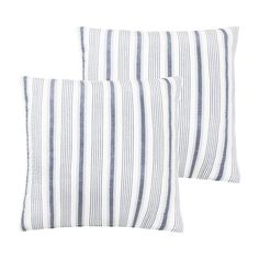 two blue and white striped pillows sitting next to each other on top of a white surface