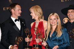 three men and two women posing with their awards