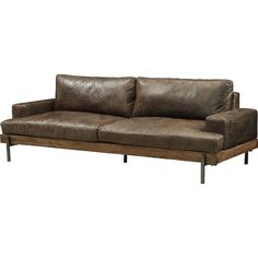 a brown leather couch sitting on top of a wooden frame