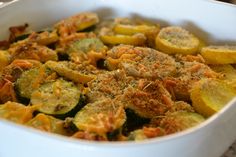 a casserole dish with zucchini and squash