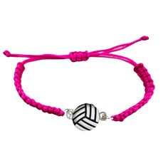 a pink bracelet with a black and white ball on it