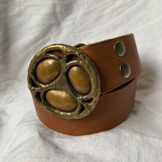 "You are looking at a genuine tan leather belt with two tone brass buckle. Belt measures 38\"2 long with 29\"7 from the first perforation and 36\"7 at it's last perforation from buckle and 1\"6 wide. The condition of this belt is good and is made of tan leather with great detail in buckle. The leather belt is thick and strong and there was a last perforation on end and the buckle is custom made. ------------------------------------I SHIP WORLDWIDE------------------------------------------------- Tan Leather Belt, Brass Buckle, Buckle Belt, Shopping Tote Bag, Perfect Bag, Signature Logo, Black And Tan, Tan Leather, Leather Belt