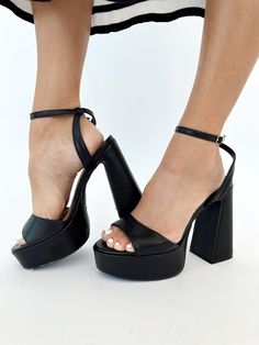 Elevate your style with our Black Open Toe Platform Heel. This elegant heel features a platform and block heel for elevated comfort, perfect for formal occasions like dinner, drinks, or date night. The open toe and strappy details add a touch of sophistication, making it a must-have for any fashion-forward individual. Heel height: 5" Dinner Drinks, Elegant Heels, Platform Heel, Platform Heels, Formal Occasion, Block Heels, Open Toe, Date Night, Fashion Forward