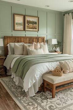 a large bed sitting next to a window in a room with wooden floors and green walls