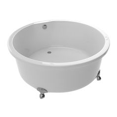 a white bath tub sitting on top of a metal stand