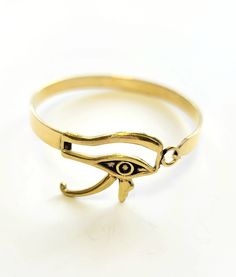 Eye of Horus Semi-Cuff - MINU Jewels Adjustable Hinged Metal Cuff Bracelet, Adjustable Symbolic Gold Cuff Bracelet, Gold Symbolic Bangle Cuff Bracelet, Symbolic Gold Bangle Cuff Bracelet, Adjustable Hinged Gold Bangle, Hinged Metal Cuff Bracelet As Gift, Horus Design, God Eye, Egyptian God