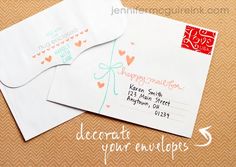 two envelopes with hearts on them are sitting next to each other