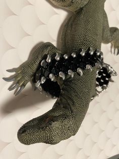 This woven Czech glass dragon scale bracelet is metal AF! Ultra shiny jet black dragon scales as far as the eye can see! It is one of my "Croc Monitor" designs since the fine curved dragon teeth on the side resemble croc monitor teeth. (Croc Monitor jewelry pattern set coming to the store soon!) While it has those teeth, it is very soft and unintrusive to wear. This bracelet is securely hand-stitched with ultra-bonded Beyond Braid with zinc alloy hardware and toggle clasp for additional stability. 1.5" wide. 8" long as you can see in the pic with the measuring tape, so it's somewhat in the plus size range (or suitable for men with larger wrists) and I can extend it with chain, but unfortunately can't shorten it. However, if you'd like a shorter length, I can custom-make a Croc Monitor brac Dragon Claw Jewelry, Dragon Scale Gloves, Lizard Bracelet, Dragon Scale Bracelet, Dragon Vein Agate Bracelet, Snake Bracelet, Dragon Scale, Silver Dragon, Black Dragon