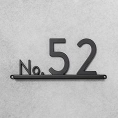 a metal sign that says no 52 on it