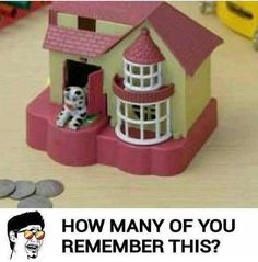 a toy house sitting on top of a wooden table next to stacks of coins and a sign that says how many of you remember this?