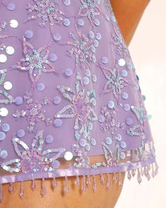 Let the Sweet Serenade Floral Sequin Dress beguile their curious hearts! Bedazzled with iridescent sequins, this flirty dress mirrors the enchanting chaos of Wonderland itself. And with each twirl, you're embodying a whimsical journey through a magical realm. Thick adjustable straps 95% Polyester 5%Spandex Hand Wash Glamorous Purple Sequin Mini Dress, Glamorous Purple Mini Dress With Sequins, Purple Sequin Dress For Summer, Fitted Lavender Sequined Dress, Glamorous Lavender Dresses, Summer Purple Sequined Mini Dress, Purple Sequined Mini Dress For Summer, Spring Purple Mini Sequin Dress, Purple Mini Sequin Dress For Spring