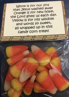 candy candies in plastic wrapper with an orange and yellow candy corn on top