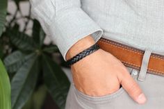 A stylish woven leather bracelet featuring braided leather strap and finished by a secure magnetic clasp. For additional information, please feel free to contact us. Classic Black Braided Bracelet, Everyday Black Braided Leather Bracelet, Casual Braided Leather Bracelet, Casual Leather Braided Bracelets, Casual Leather Bracelets With Braided Details, Casual Braided Leather Bracelets, Handmade Black Leather Braided Bracelet, Casual Everyday Braided Bracelet With Black Band, Leather Bracelets Women