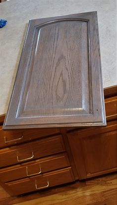 a close up of a wooden cabinet with drawers