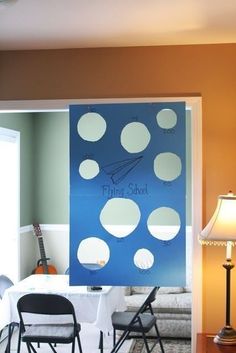 a blue and white wall with polka dots on it