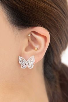 These exquisite silver crystal butterfly earrings are perfect for any occasion. Crafted from sterling silver with 14k white gold plating, they feature a stunning butterfly design. The stud finish is a superior way to keep the earrings securely in place. Material: 14k White Silver Plating, Sterling Silver Post Closure Type: Stud finish Butterfly design Weight: 3 Grams Measurement: 0.75in or 1.91cm Nonrefundable Crystal Butterfly, Wardrobe Accessories, Buy Crystals, Butterfly Earrings, Keep Jewelry, Butterfly Design, Earrings Silver, Bridal Accessories, Earring Necklace