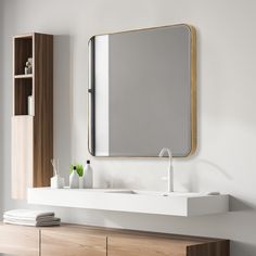 a bathroom with a sink, mirror and shelf on the wall next to it's drawers