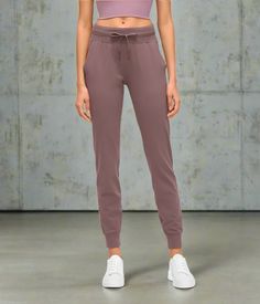 Introducing the Active Stride Women's Joggers – your ultimate go-to for life on the move and active living! These athletic pants are crafted from high-quality, breathable fabric, offering lasting comfort while adding a stylish touch to your wardrobe. Whether you're hitting the gym, going for a run, or enjoying a casual day, they have you covered. The sleek, versatile design seamlessly transitions from workout sessions to brunch, ensuring you look chic for any occasion. With a secure fit and a range of sizes, celebrate your shape and enhance flexibility. Whether running errands or breaking a sweat, they are perfect for every activity. Embrace both style and performance with the Active Stride Women's Joggers, made for women who want it all! Full-length Workout Joggers With Pockets, Mid-rise Athleisure Joggers With Elastic Waistband, Athleisure Full-length Joggers With Side Pockets, Full-length Leisure Joggers With Pockets, Stretch Full-length Joggers With Side Pockets, Women's Joggers, Womens Athletic Outfits, Active Living, Swim Shop