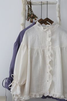 "This is a new-made linen blouse. Fully edged with lace. The sleeves is specially designed. Cuff tied with bow tie. Cute and romantic. Made of 100% nature linen. There are 2 colors available, white and bluish violet. Measures approximately (Loose type, suitable for all body types): 1/2 Bust: 80cm (31.5\") Length: 65cm (25.6\") Shoulder to Shoulder: 57cm (22.44\") ruffle Sleeve: 43cm (17\") There may be 1-2cm measurement margin. ---------------------------------------- Linen is a washable fabric, Romantic White Blouse, Vintage Sleeves, Ruffle Shirts, Cute Sleeves, Shirt Types, White Linen Blouse With Lace Trim, White Shirt Design, Shirt White, Designer Shirts