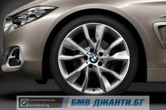 the front wheel of a silver bmw car