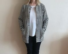 "MARIMEKKO Cardigan White Black Striped Cotton Jacket Womens Marine Cardigan Nautical Jacket Made in Finland Medium Size Label size: M Shown on model M/L Measurements (lying flat): Length: 30.5\"/ 77.5 cm Shoulders: 18\"/ 46 cm Sleeve: 21 3/4\"/ 55 cm Pit to pit: 22\"/ 56 cm Condition: Good Vintage Condition Material: 100%cotton Made in Finland N.B. Color may slightly differ from picture. Please check measurements to insure a proper fit. Remember to allow yourself some extra room for movement. You can compare these with something from your closet that fits you well. Please convo me if you need additional measurements. SHIPPING * I ship worldwide via Priority mail  * I ship from Europe, so please allow 2 to 4 weeks for the package to arrive if you live overseas. * Europe 5 - 10 business day Striped Button Cardigan For Work, Striped Cardigan With Buttons For Work, Casual Striped Outerwear With Buttons, Casual Striped Outerwear For Work, Striped Oversized Outerwear For Work, Striped Long Sleeve Outerwear For Layering, Finnish Clothing, Silk Skirt Midi, Tartan Hat