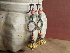 A pair of long boho flower earrings, in cheerful springtime yellow, pink, and teal. These beautiful yellow flower beads were handmade by artisans in the Czech Republic. To complement their color, I paired them with pink and teal beads, and hung them from a textured copper ring to give them a boho feel. At the top, I hung them from antiqued copper leverback earwires. These earrings are almost 3 inches long, or about 7.5 cm, including the leverback earwires. They are also available with ordinary French earwires, which are a similar length. All the beads are Czech glass, and the metal is antiqued copper colored or plated. Victorian Style Earrings, Red Flower Earrings, Boho Drop Earrings, Czech Glass Necklace, Vintage Inspired Earrings, Crystal Pearl Earrings, Vintage Style Necklace, Clear Earrings, Glass Drop Earrings