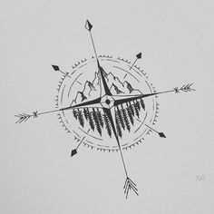 a compass tattoo with trees and mountains in the background