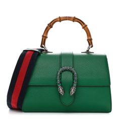 This is an authentic GUCCI Dollar Calfskin Crystal Web Medium Dionysus Bamboo Top Handle Bag in Emerald. This exquisite bag is crafted of textured calfskin leather. The bag has a sturdy bamboo top handle, an optional webbed nylon shoulder strap and a prominent crystal-embellished tiger head horseshoe closure. The flap opens to reveal a natural fabric partitioned interior with patch pockets and a central dividing zipper compartment. Green Gucci Bag With Detachable Handle, Gucci Calf Leather Shopping Bag, Gucci Leather Top Handle Bag, Gucci Leather Satchel For Daily Use, Gucci Leather Rectangular Satchel, Gucci Green Satchel Bag, Gucci Bags With Leather Lining For Daily Use, Gucci Leather Evening Satchel, Gucci Leather Satchel For Evening