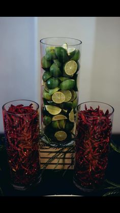 three glasses filled with green and yellow fruit