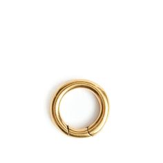 a gold colored metal ring on a white background with clipping to the side for text