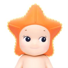 a close up of a toy with an orange hair and blue eyes on a white background