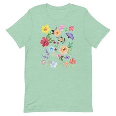 "Check out our hand designed vintage inspired floral t-shirt, sure to be the \"one\" for the nature lover in your life. It's placed on a gorgeous bella canvas shirt with ringspun cotton and a hint of polyester for that perfect amount of stretch. OUR SHIRTS ARE PRETTY GREAT, no really :) ✔ ALL SHIRTS are super soft and comfy. We're really picky about selecting only best materials around. All garments are printed with love and care here in the USA at one of our two materials partners; whichever is Graphic Tee With Watercolor Print In Cotton, Summer Graphic Tee With Watercolor Print, Green Custom Print T-shirt For Spring, Green Graphic Tee With Floral Print, Botanical Screen Print T-shirt For Summer, Botanical Style Green T-shirt With Graphic Print, Nature-inspired Short Sleeve T-shirt For Summer, Botanical Screen Print T-shirt For Spring, Nature-inspired Cotton T-shirt For Spring