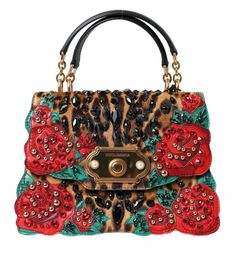 Step out in style with this exquisitely crafted Dolce & Gabbana tote bag. Adorned with a leopard print, this piece exudes elegance with its red rose and crystal embellishments. The bag boasts practicality with its ample storage, featuring two internal compartments, and versatility with a detachable shoulder strap. It’s completed with the brand’s signature gold-tone hardware and a secure flap push lock closure. While this item shows unparalleled craftsmanship, please note it carries a slight imperfection with some scratches on the bottom. Material: 60% Calf Fur, 40% Leather Color: Brown leopard with gold metal detailing Country of Origin: IT Dimensions: 25cm x 17cm x 12cm Strap: Two top handles, Detachable shoulder strap, 63cm x 3.5cm Roses Embroidery, Leopard Print Tote, Crystal Embroidery, Leopard Black, Fur Bag, Brown Leopard, Dolce E Gabbana, Print Tote, Dolce & Gabbana