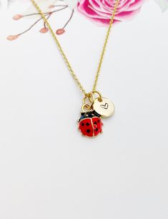 This is an alloy red ladybug charm with hand stamped initial charm on a stainless-steel or brass chain. ♥ You will receive 1 necklace. HOW TO ORDER 1) Select the quantity 2) Select the stamp and finish. 3) Add to cart DESCRIPTION ♥ Necklace, Stainless Steel or Brass Cable Chain 18 inches, Nickel Safe. ♥ Initial Charms, Stainless steel, Size: about 8-10mm in diameter, 1mm thick, Nickel Safe, ♥ Alloy Enamel Charms, 3D Ladybug Charms, Golden, Size: about 0.35 inch(9mm) wide, 0.49 inch(12.5mm) long, 0.18 inch(4.5mm) thick,  ♥ Materials from the USA and international sourcing, Made and ship from Gowen, Michigan. GIFT READY: ♥ Invoice will be sent to you by email. We will not include invoice in the package unless requested. ♥ Every piece Jewelry comes on Lebua Jewelry® card, wrapped in a plastic Cute Red Charm Necklace For Gift, Cute Red Charm Necklaces For Gifts, Red Charm Necklaces For Mother's Day Gift, Red Charm Necklace For Mother's Day Gift, Cute Handmade Red Charm Necklaces, Cute Handmade Red Charm Necklace, Cute Red Handmade Charm Necklace, Personalized Red Jewelry Gift, Personalized Red Jewelry For Gift